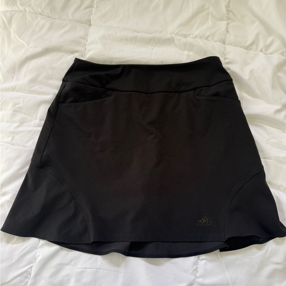 A set of 3 Adidas Women's Classic Black, Navy and white golf skirts . - Picture 1 of 4